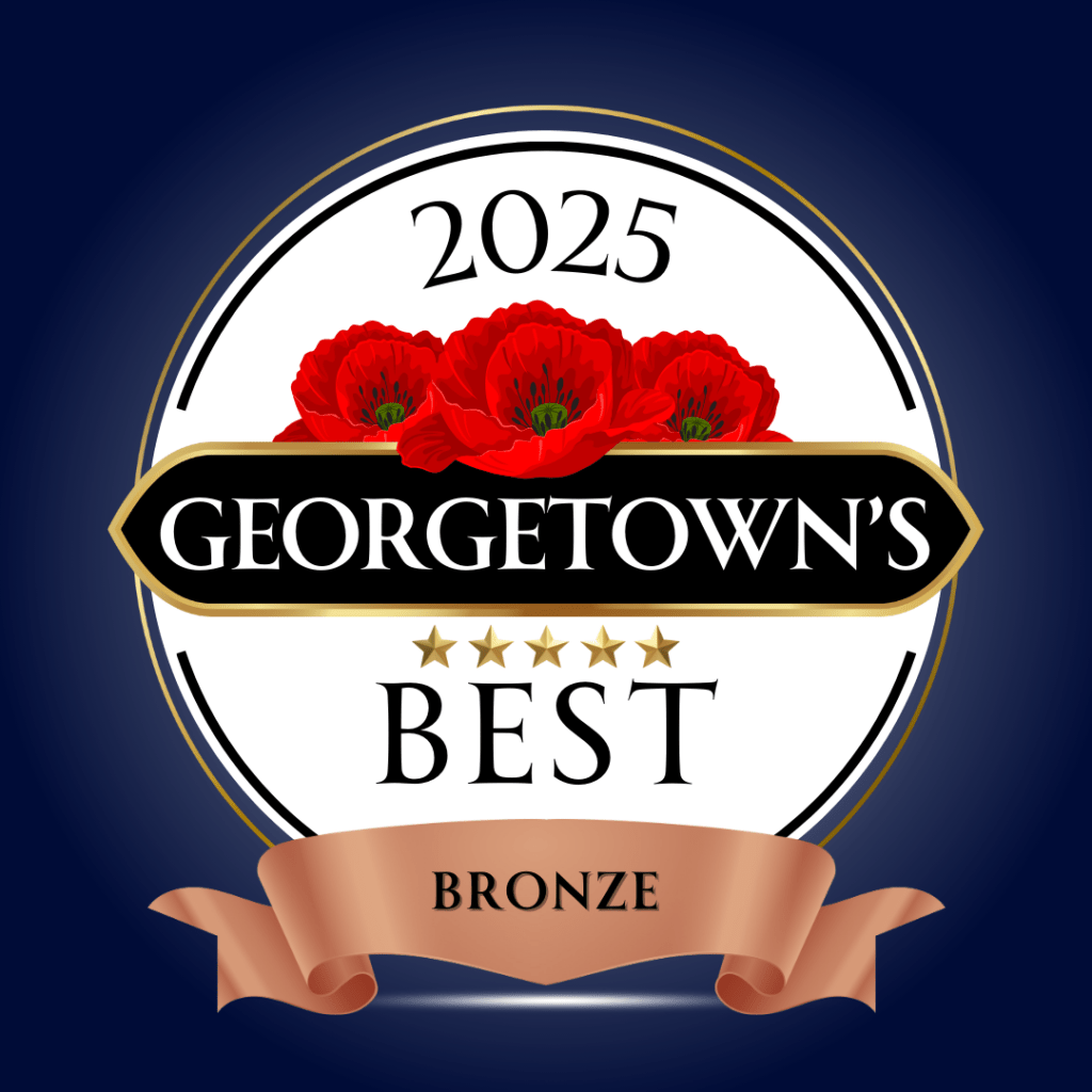 A circular badge with red poppies, five gold stars, and the text "2025 Georgetown's Best Bronze" on a ribbon against a dark blue background.